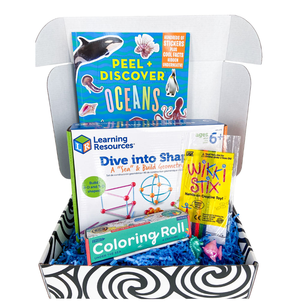 OuT of the Box educational occupational therapy activity set in an ocean theme with books and materials on a white background.