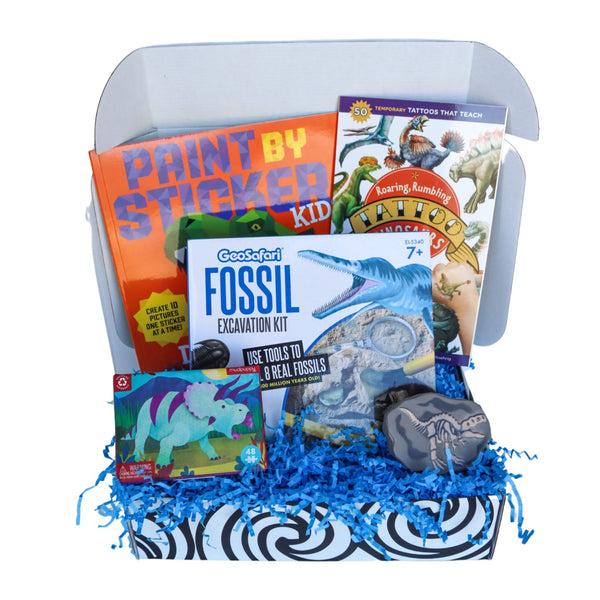 OuT of the Box educational occupational therapy activity set in a dinosair theme with books and materials on a white background.